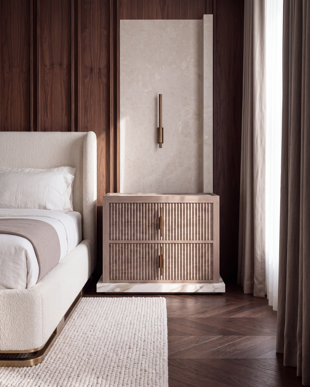 Reeded bedside in walnut and veined porcelain beside an upholstered bed